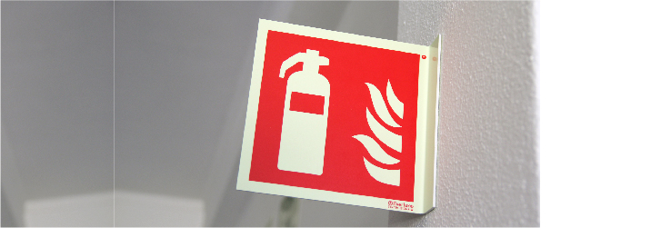 Skilt for gassbaserte brannslukkingssystemer installert i kjøkken